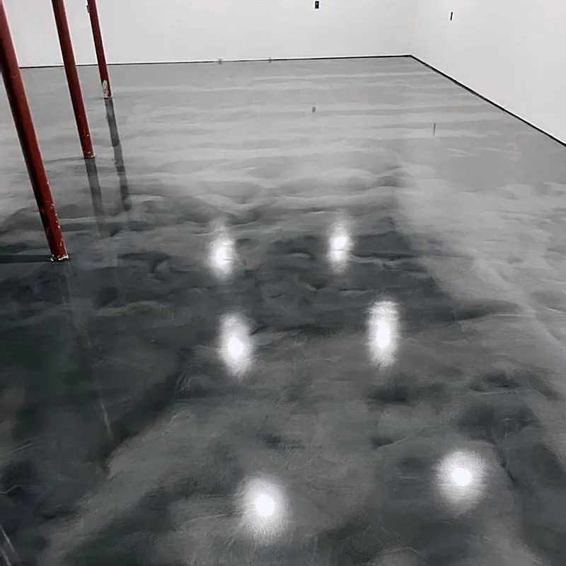 Grey coated basement floor around structural support posts