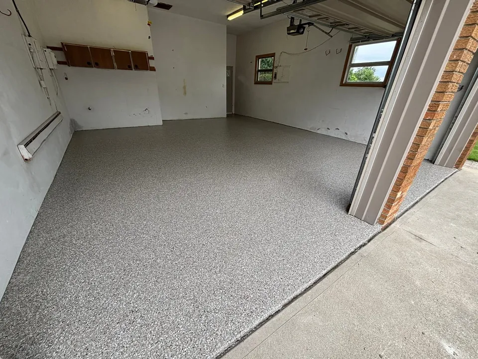 Grey speckled coated floor in a large commercial interior