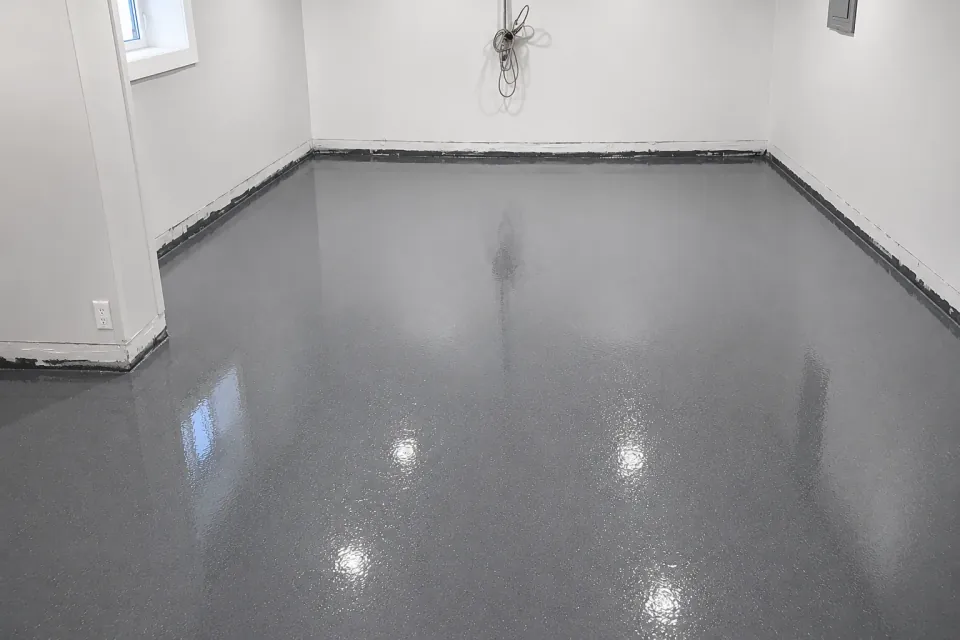 Grey speckled finish on a residential garage floor
