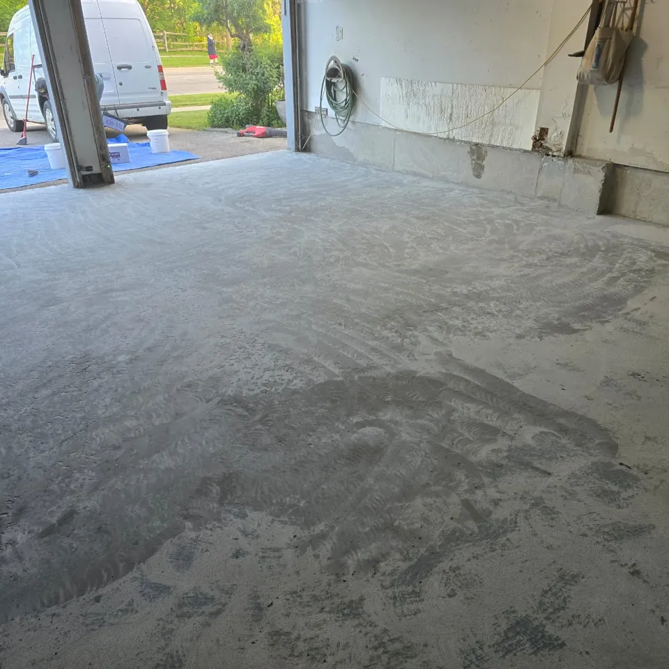 Bare concrete garage floor before coating