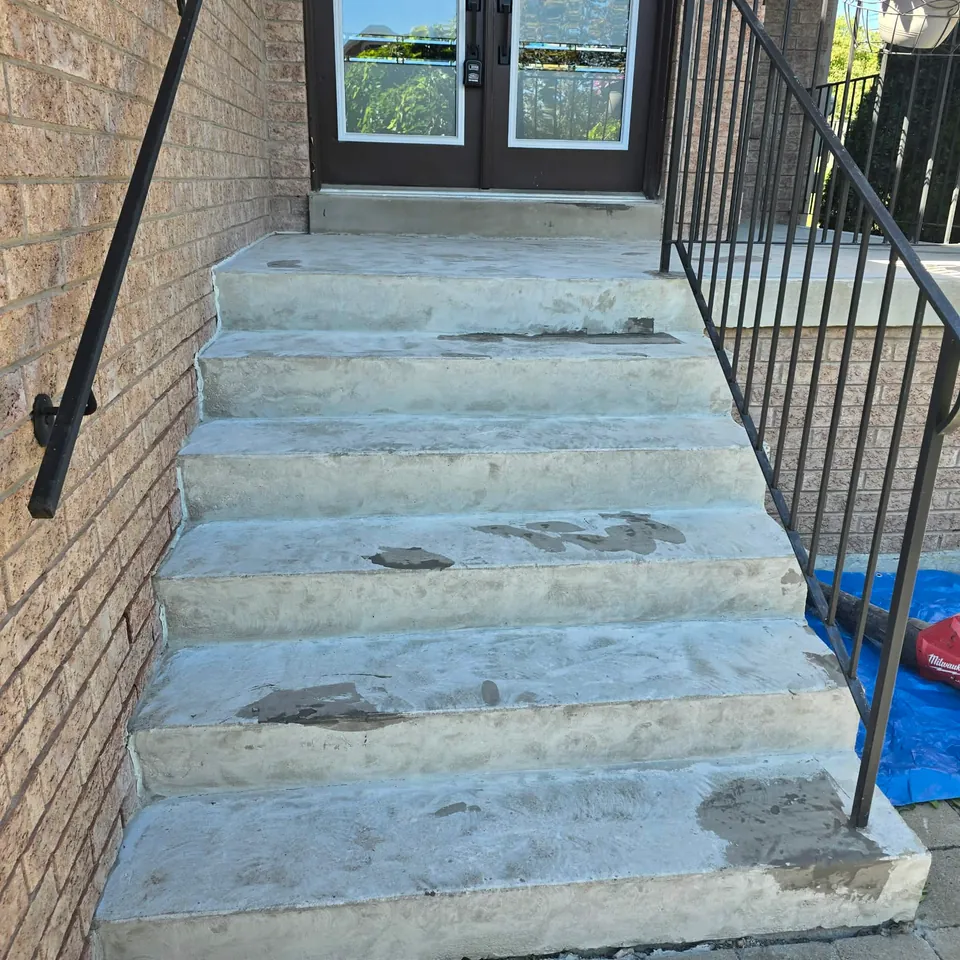 Worn concrete entry steps before coating