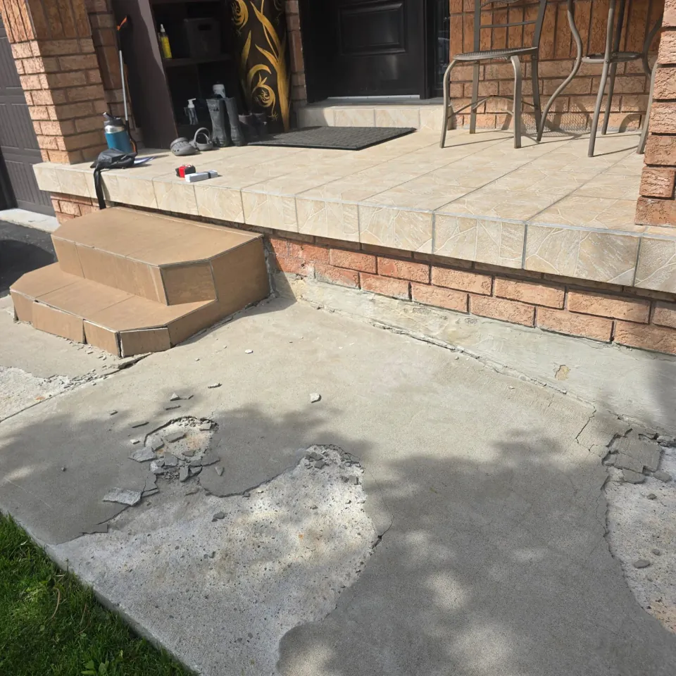 Exterior steps and patio with adjacent areas protected during preparation