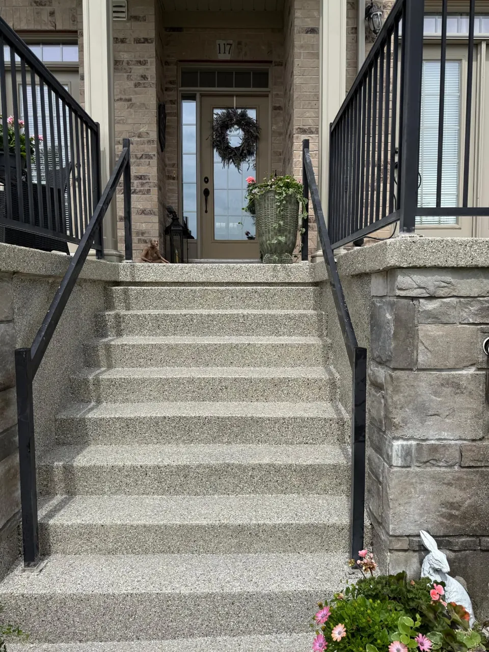 Entry steps and landing with a grey speckled coating